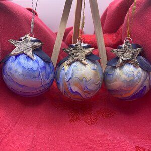 Acrylic paint pour Christmas Ornaments with rustic star and ribbon.